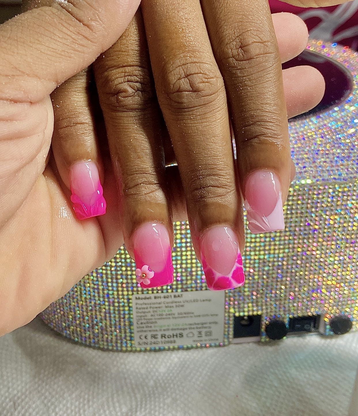 Stylish Pink Ombre Nails with Floral Accents